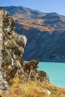 Turquoise lake in the middle of a rocky mountain landscape in autumn, Saas Fee, Switzerland, Europe