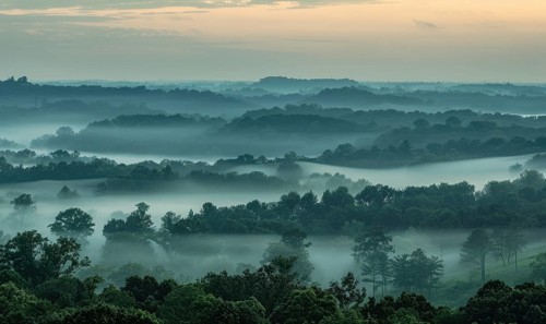 Hazy sky and thin layers of clouds, mist in the mounts AI generated