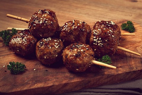 Tsukune, Japanese meatballs, minced chicken, fried on a skewer, with yakitori sauce, homemade, no