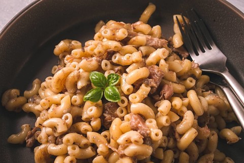 Pasta with stewed meat, pasta in the navy, horns, homemade, no people