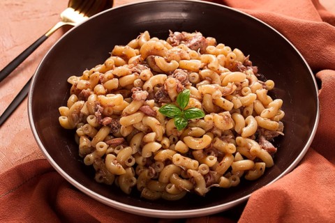 Pasta with stewed meat, pasta in the navy, horns, homemade, no people