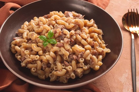 Pasta with stewed meat, pasta in the navy, horns, homemade, no people
