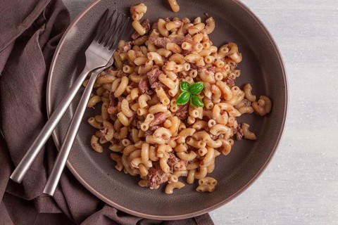 Pasta with stewed meat, pasta in the navy, horns, homemade, no people
