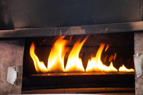 The yellow flames in a stone oven in display