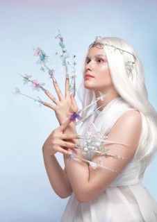 Beautiful woman with art make-up, creative long nails. Design manicure. Beauty face. Picture taken