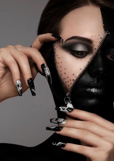 Portrait of a beautiful woman with art make-up, creative long nails. Design manicure. Beauty face.