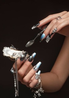 Creative design of nails on female hands. Art manicure. Photo taken in studio