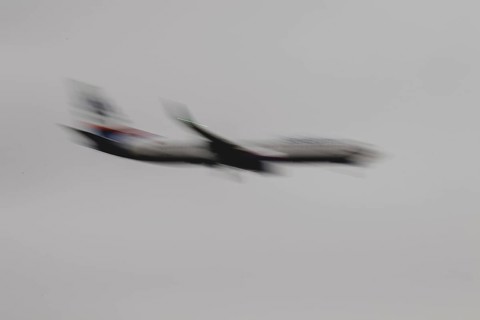 An aircraft lands, photographed at Berlin Brandenburg Airport 'Willy Brandt'Äô (BER) in Schönefeld,