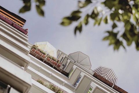 Parasols on the balcony of a prefabricated building, taken in Berlin, 07/08/2024