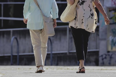 Two older woman walking together, taken in Berlin, 07/08/2024
