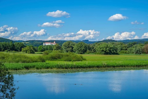 Landscape of Danubia river with reflection of the landscape and Clouds, Castle of Wörth an der