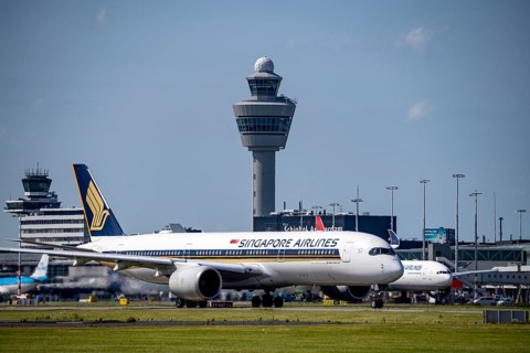 Aircraft at Amsterdam Schiphol Airport, on the taxiway for take-off on the Aalsmeerbaan, 18L/36R,