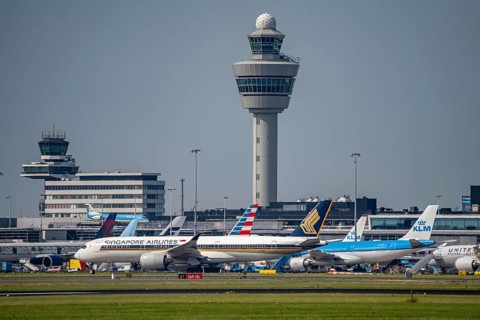 Aircraft at Amsterdam Schiphol Airport, taxiway, apron, air traffic control tower, terminal,