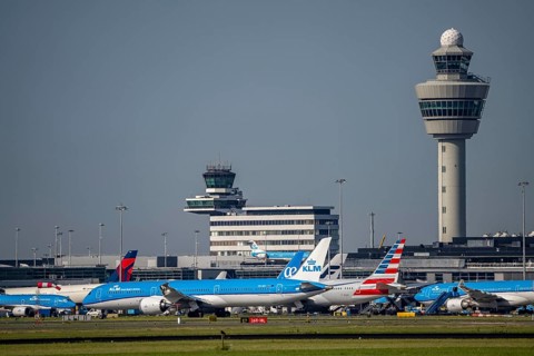 Aircraft at Amsterdam Schiphol Airport, taxiway, apron, air traffic control tower, terminal,