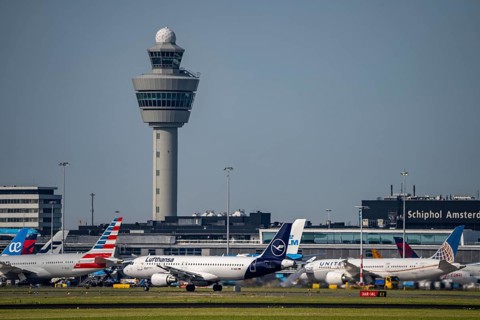 Aircraft at Amsterdam Schiphol Airport, taxiway, apron, air traffic control tower, terminal,