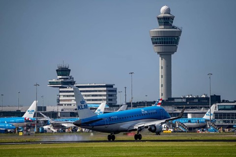 KLM Embraer E175 aircraft landing at Amsterdam Schiphol Airport, Buitenveldertbaan, 09/27, Air