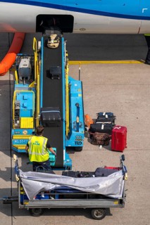 Amsterdam Schiphol Airport, loading baggage onto a plane, Boeing 737, Netherlands