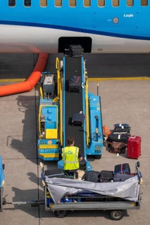 Amsterdam Schiphol Airport, loading baggage onto a plane, Boeing 737, Netherlands