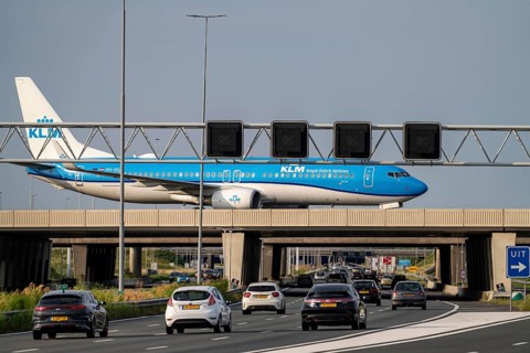 Amsterdam Schiphol Airport, KLM Boeing 737 aircraft on the taxiway, bridge over the A4 motorway,