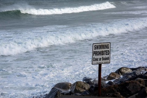 A swimming prohibited sign on a stormy day along the Wild Atlantic Way. Strandhill, Sligo, Ireland,