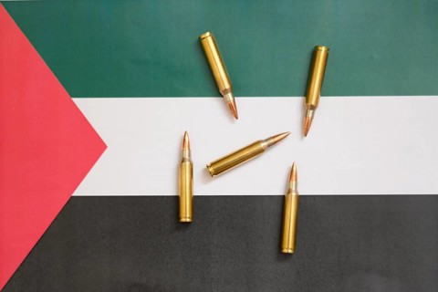 Palestinian flag with cartridges, Middle East conflict