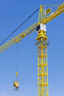 Construction crane with concrete bucket, concrete silo, crane bucket
