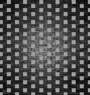 An optical illusion of gray squares on a black textured background creating a grid pattern