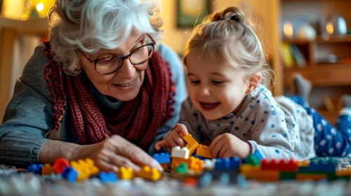 A loving grandmother and her granddaughter enjoying playtime with lego blocks in a warmly lit room,