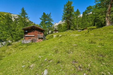 Alpine hut with chapel in the Kalser Tauern, blue sky, snow-covered mountains, Dorfertal, Hohe