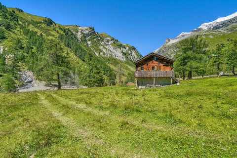 Alpine hut in the Kalser Tauern, blue sky, snow-covered mountains, Dorfertal, Hohe Tauern National