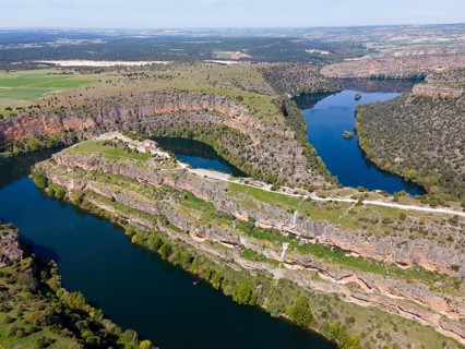 Spectacular view of a river running through deep gorges and lush vegetation, bird's eye view,