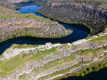 River winding through impressive gorges surrounded by dense vegetation and rocky terrain, aerial