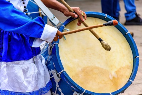 Blue wooden drum during religious festival on the streets of Brazil, Belo Horizonte, Minas Gerais,