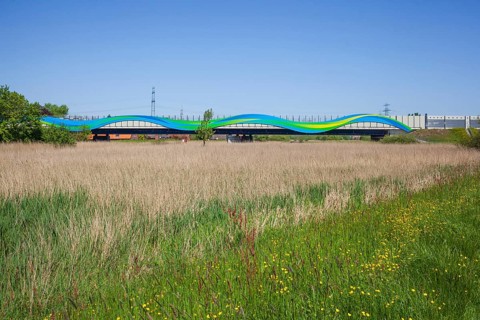 Colourfully painted motorway bridge with noise barrier over the river Este, Buxtehude, Altes Land,