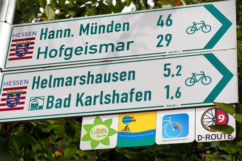 Direction signs to Hannoversch Münden, Hofgeismar, Bad Karlshafen, distance, symbol, various