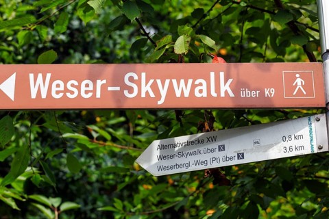 Direction sign, hiking trail to the Weser Skywalk, lettering, pictogram hiker, Weserbergland, Bad