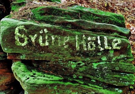 The Grüne Hölle rocky gorge, writing on mossy red sandstone in the Sauerschweiz, Southern Eifel