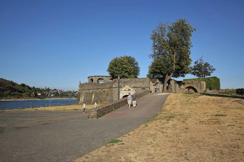 Bulwark with tower as town fortification on the banks of the Rhine, Rhine promenade, customs tower,