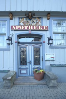 Door with decorations of the mountain pharmacy, house number, inscription, pharmacy, blue,