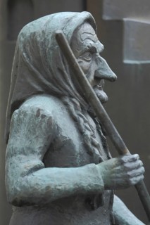Sculpture Witch by Hubert Rieber 1985 with broomstick, striking large nose, face, detail, bronze,