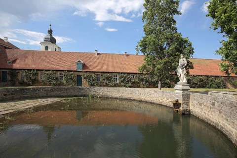 Inner courtyard with fountain at Schloss Fasanerie, statue, water basin, Eichenzell, Hesse,