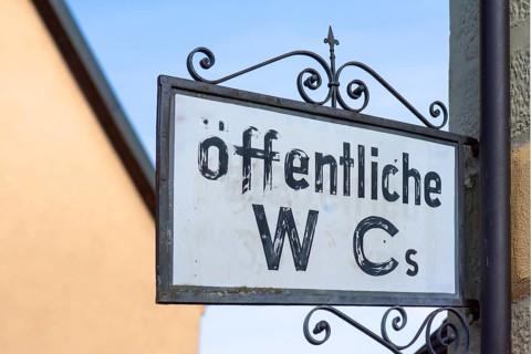 Sign for public WC's, Kitzingen, Lower Franconia, m Bavaria, Germany, Europe