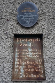 Historic tin sign on the house from 1497 of the last plaster customs station of Mainbernheim, Lower