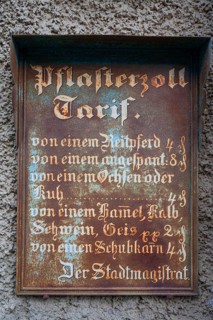 Historic tin sign on the house from 1497 of the last plaster customs station of Mainbernheim, Lower