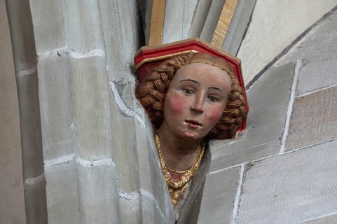 Young woman's head console stone in Heilig Kreuz Minster, Rottweil, Baden-Württemberg, Germany,