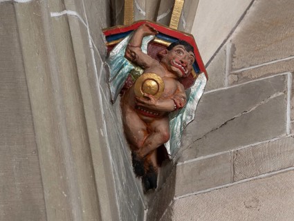 Devil with convex mirror, console stone in Heilig Kreuz Minster, Rottweil, Baden-Württemberg,