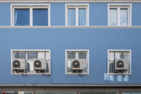 Air conditioning units outside the window of an apartment block, Kitzingen, Unterfanken, Bavaria,