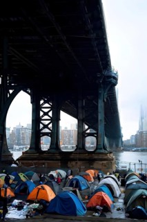 Homeless individuals huddled together in a makeshift tent city, AI generated