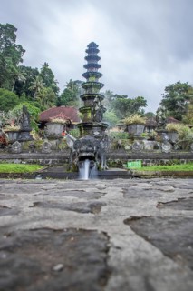The water temple or water palace of the king. Tropical landscapes, colourful flowers and statues