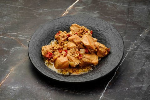 Traditional Georgian meal, kharcho, chicken fillet ragout with walnuts